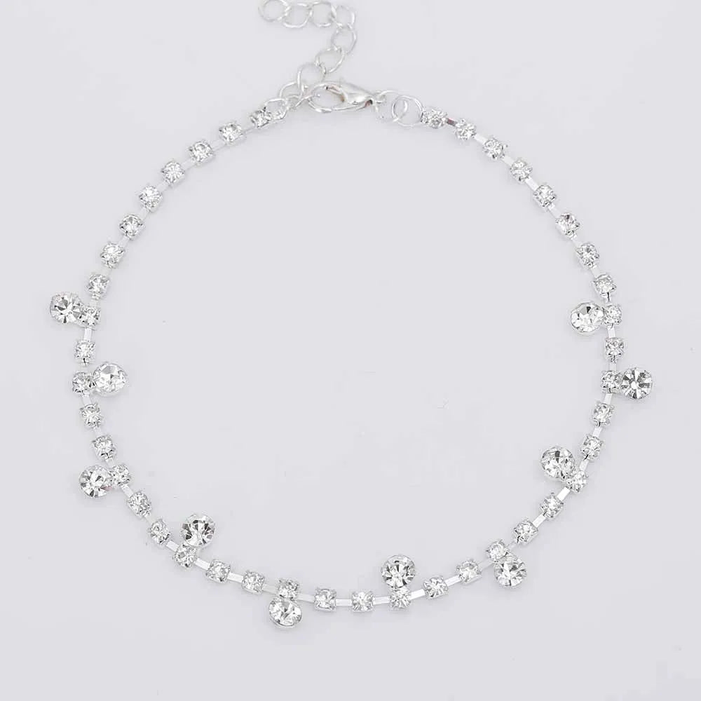 Silver alloy women's anklet with water drop tassel and stone inlay on a white background showing chain and clasp