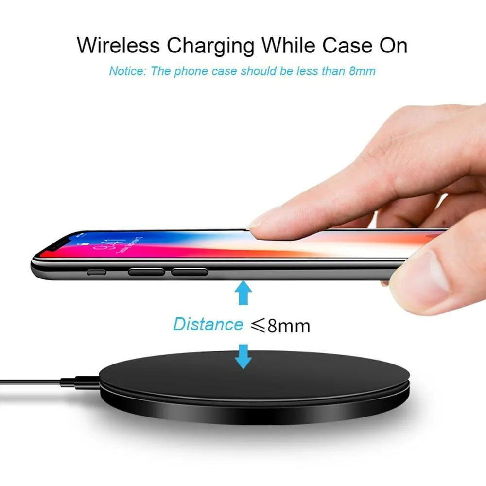 Black square ultra-thin wireless fast charger with USB cable on a desk