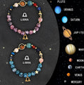 Two natural stone beaded bracelets with zodiac sign designs on a wooden surface