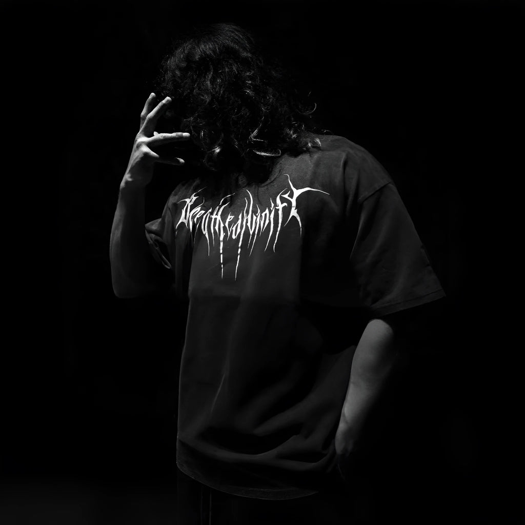 Dark style men's loose cotton short-sleeve T-shirt with gilding craft detailing on a mannequin.