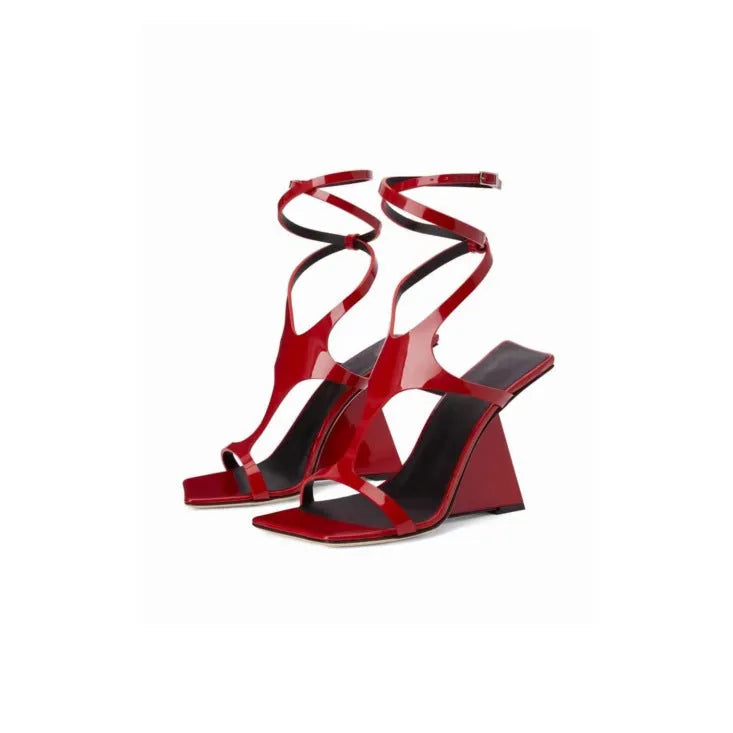Women's black high heel sandals with 9.5cm heel and button fastening on a square toe.