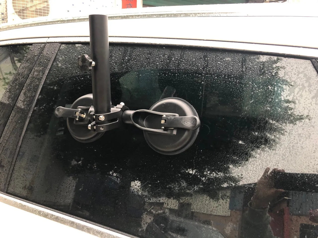 Black car sucker base with round suction cup for off-road flagpole mounting on vehicle windscreen