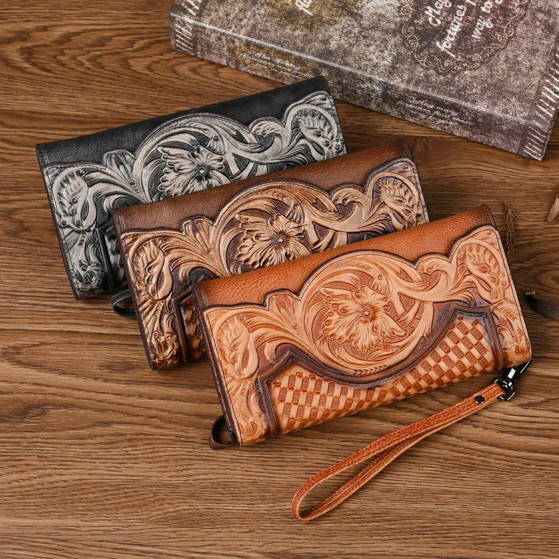 Brown genuine leather women's tri-fold wallet with embossed floral pattern showing interior compartments
