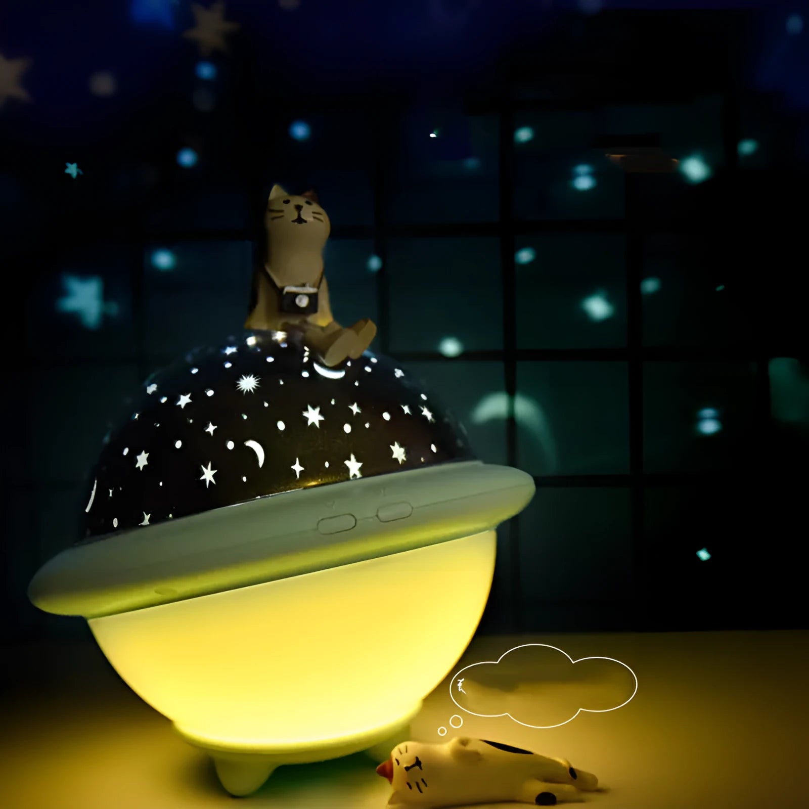 Green UFO-shaped night light projecting a starry sky pattern onto a surface, showing its modern plastic design.