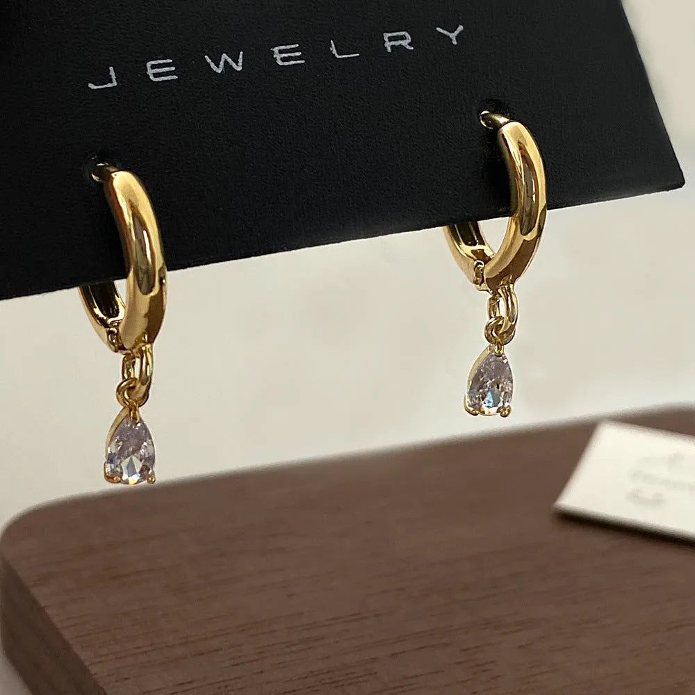 Zircon jewellery set with geometric necklace, earrings and anklet featuring meteor shower design elements