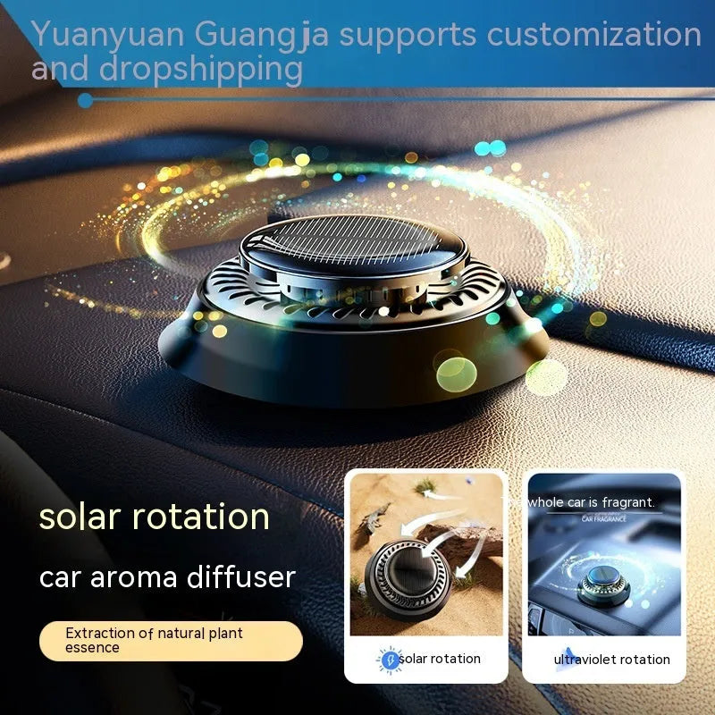 Solar powered double ring rotating car air freshener in Black Ocean colour placed on car dashboard