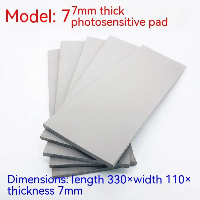 Black and grey plastic photosensitive seal mat measuring 330mm by 110mm.