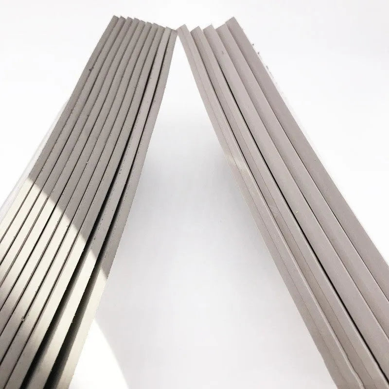 Black and grey plastic photosensitive seal mat measuring 330mm by 110mm.