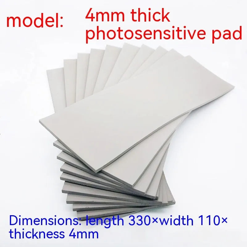 Black and grey plastic photosensitive seal mat measuring 330mm by 110mm.