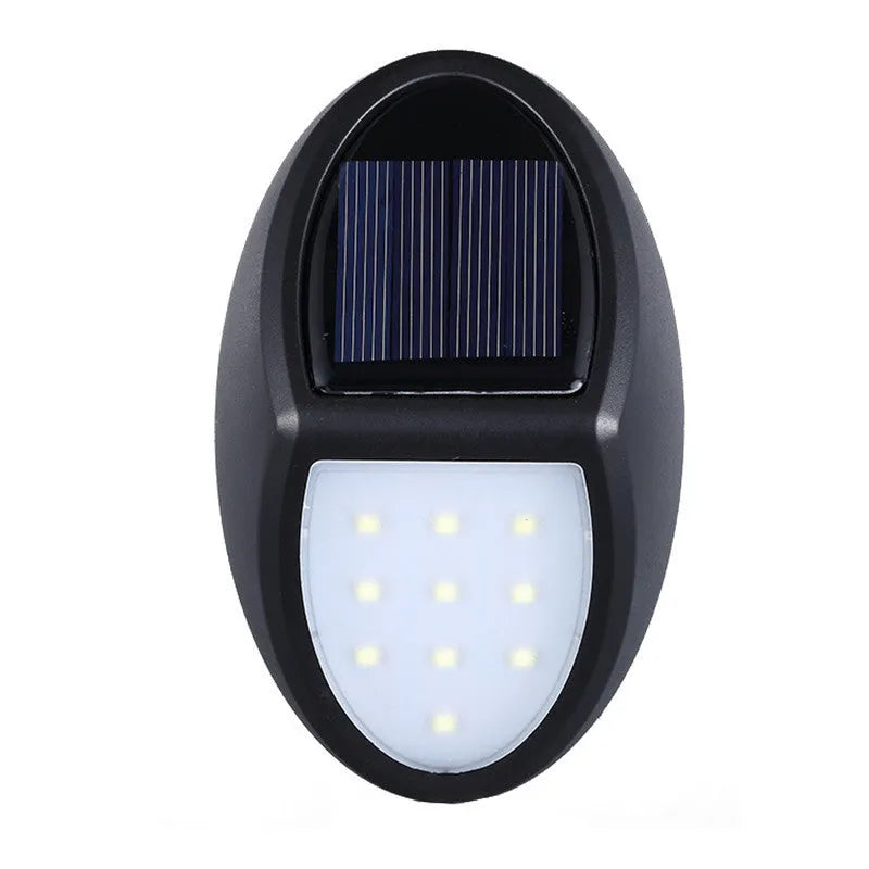 Black rectangular LED solar wall light for outdoor mounting with a solar panel on top.