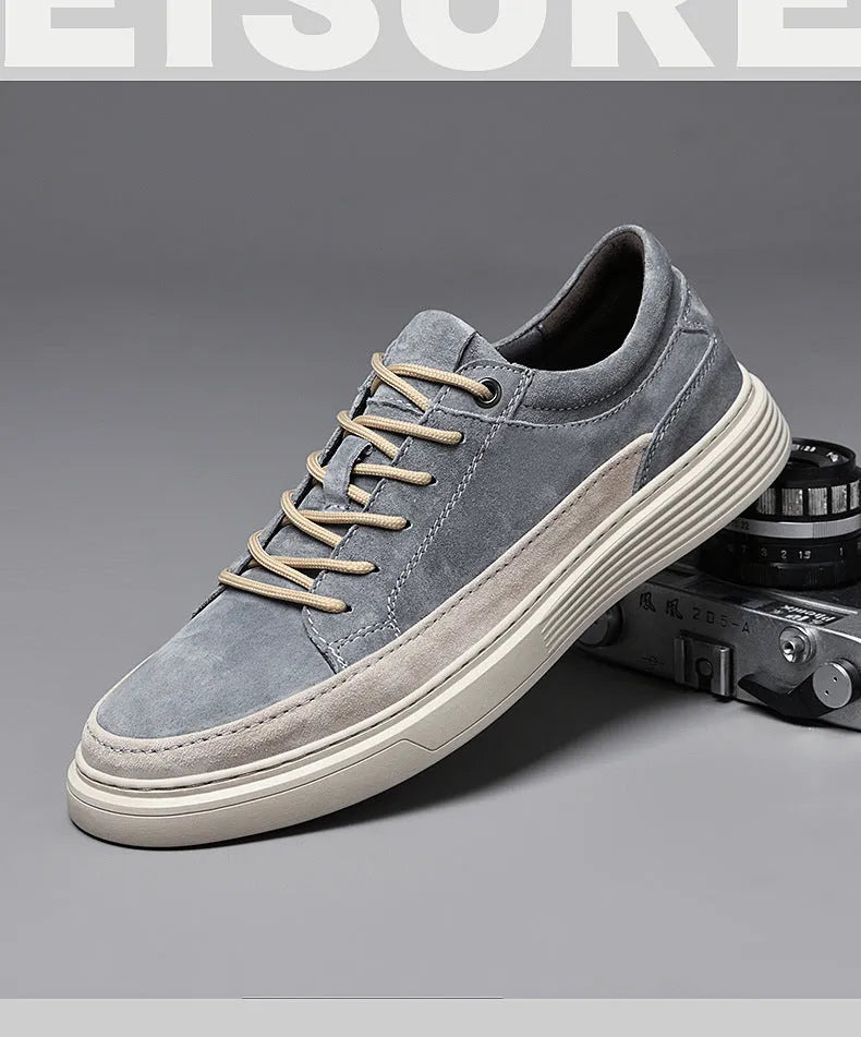 Men's grey low-top casual leather skate shoes with a round toe and flat rubber sole.