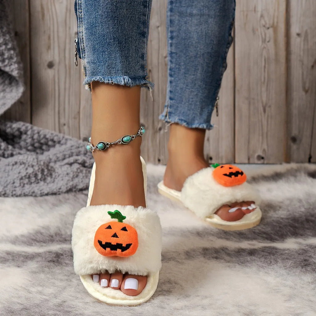 White and yellow pumpkin-themed plush open-toe slippers with a synthetic fur upper.