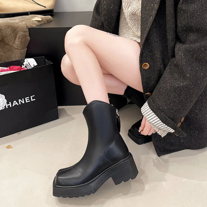 Black square toe platform ankle boots for women with a back zipper and chunky heel.