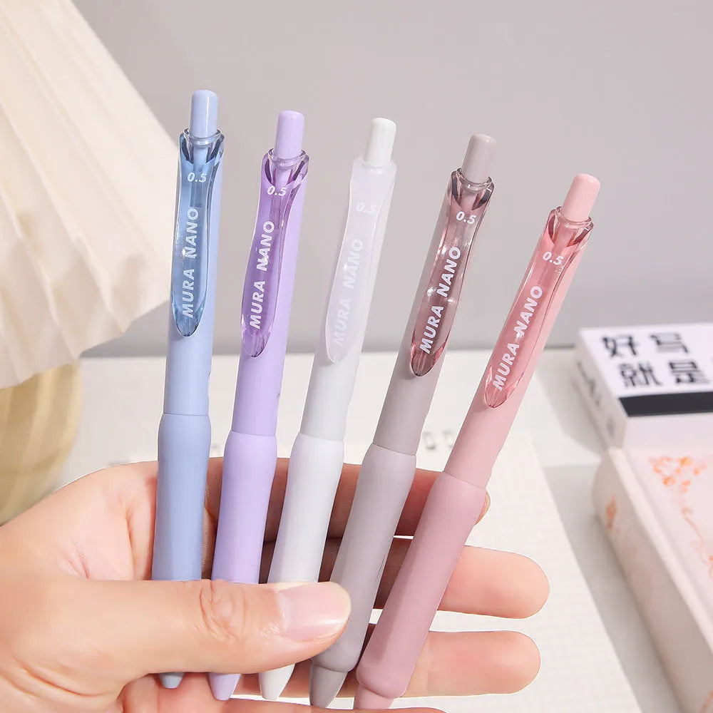 Macaron colour press gel pen with 0.5mm tip shown in Smoked Brown, Smoked Powder, and Smoked White refill options.