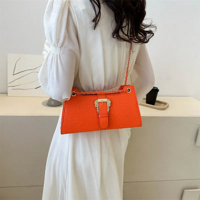 Women's PU horizontal square crossbody bag in orange with single shoulder strap and sandwich pocket
