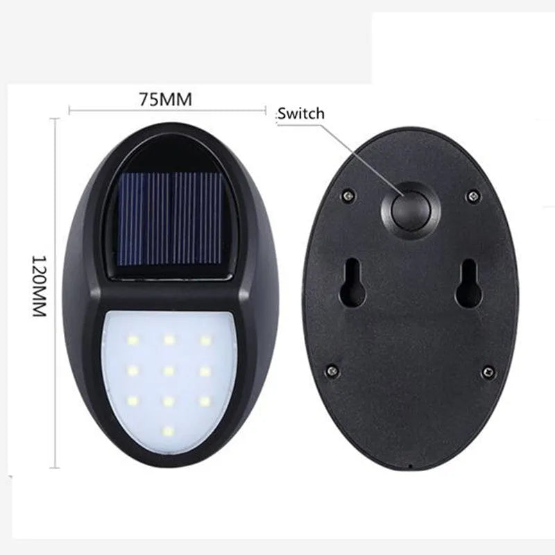 Black rectangular LED solar wall light for outdoor mounting with a solar panel on top.