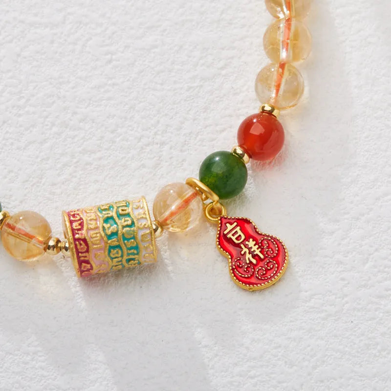 Citrine five sutra hand-woven crystal bracelet with geometric design on neutral background