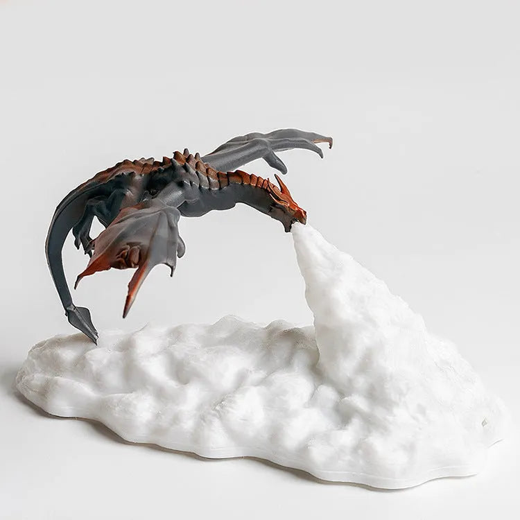 3D printed red dragon night light glowing on a table with USB cable