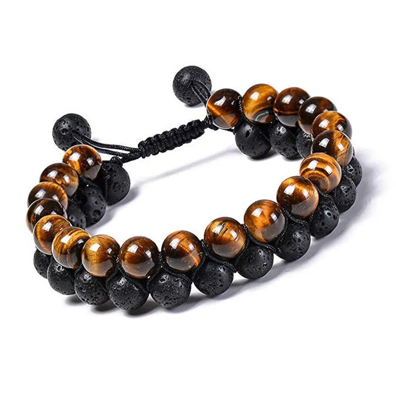 A pair of geometric bracelets with matte black tiger eye agate beads on an adjustable strap.