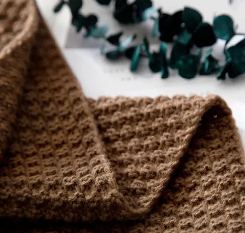 Acrylic knit ball blanket in beige colour, measuring 130 by 170 centimetres, laid flat.