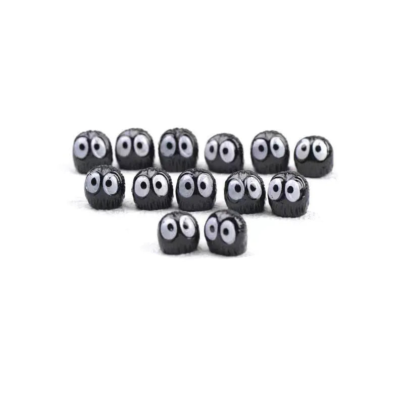 Small black resin car briquette decoration with cartoon design