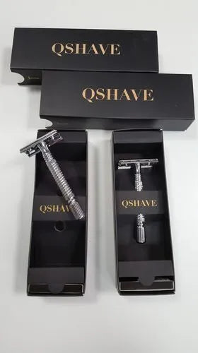 Stainless steel double edged safety razor with ergonomic handle, five blades, and a black travel case.