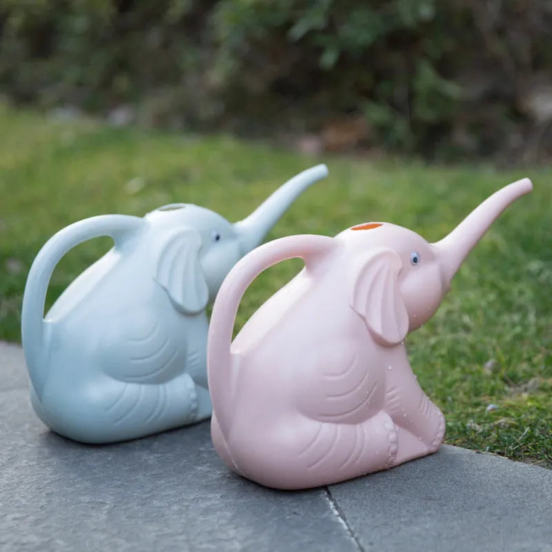 Pink baby elephant-shaped watering can with long nozzle and handle for child's hand