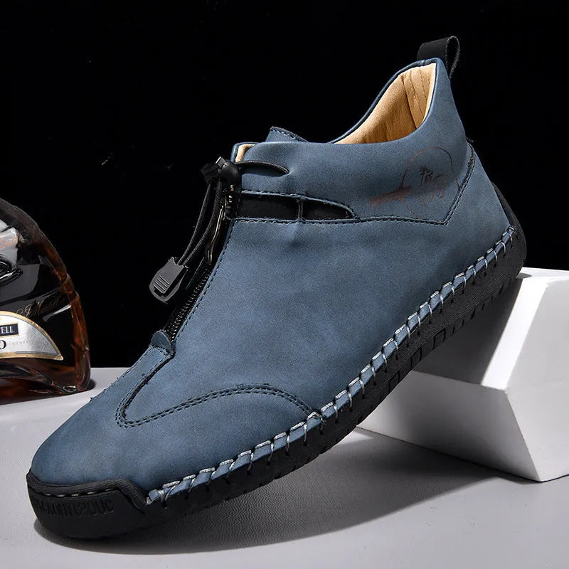Men's black casual leather shoes with a round toe and mid-height rubber sole.