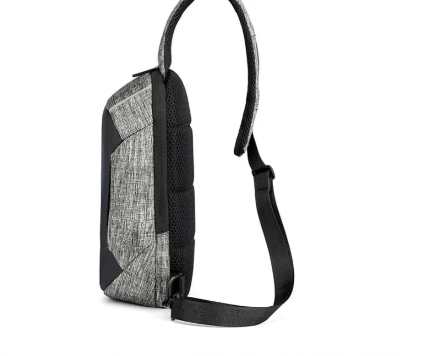 Small dark blue oxford cloth waterproof chest bag with a single strap, shown with the zipper open.