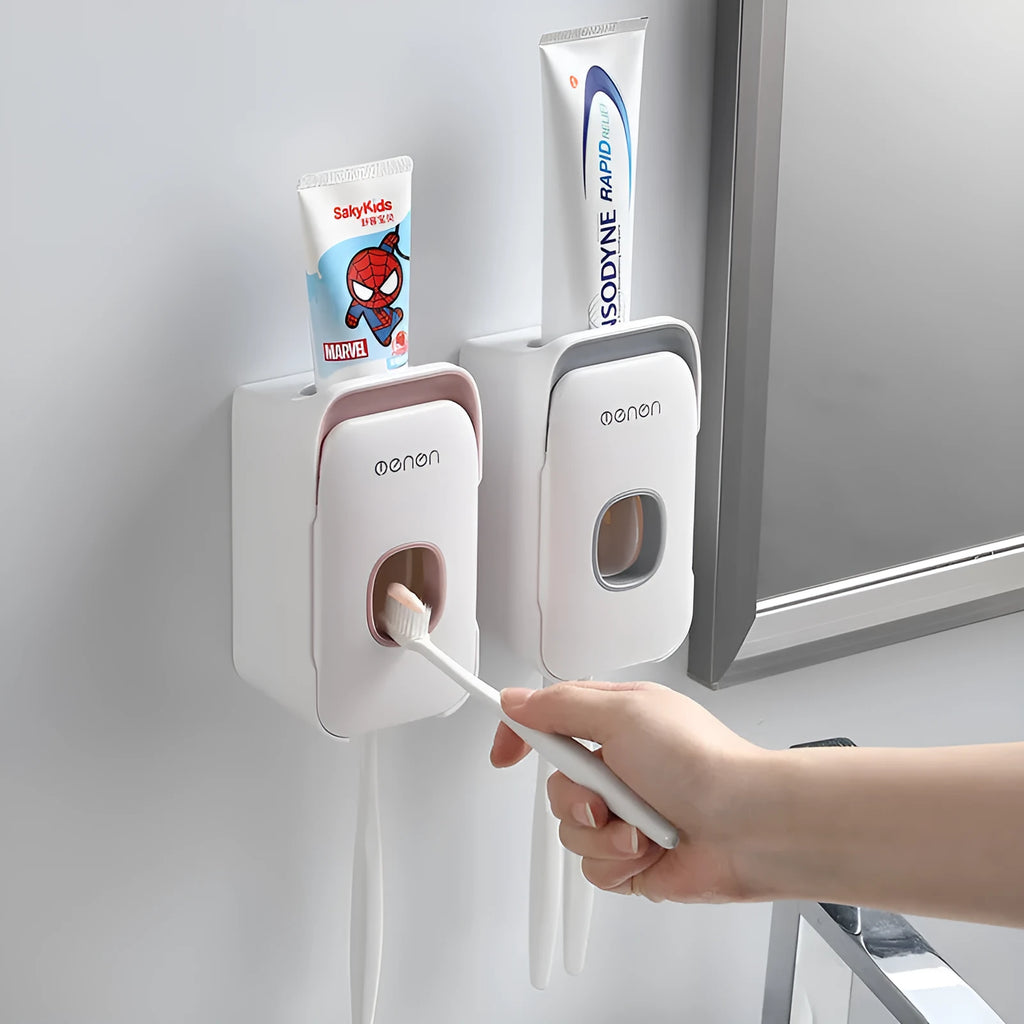 Automatic toothpaste dispenser unit in blue, grey, and pink colours made from ABS plastic.