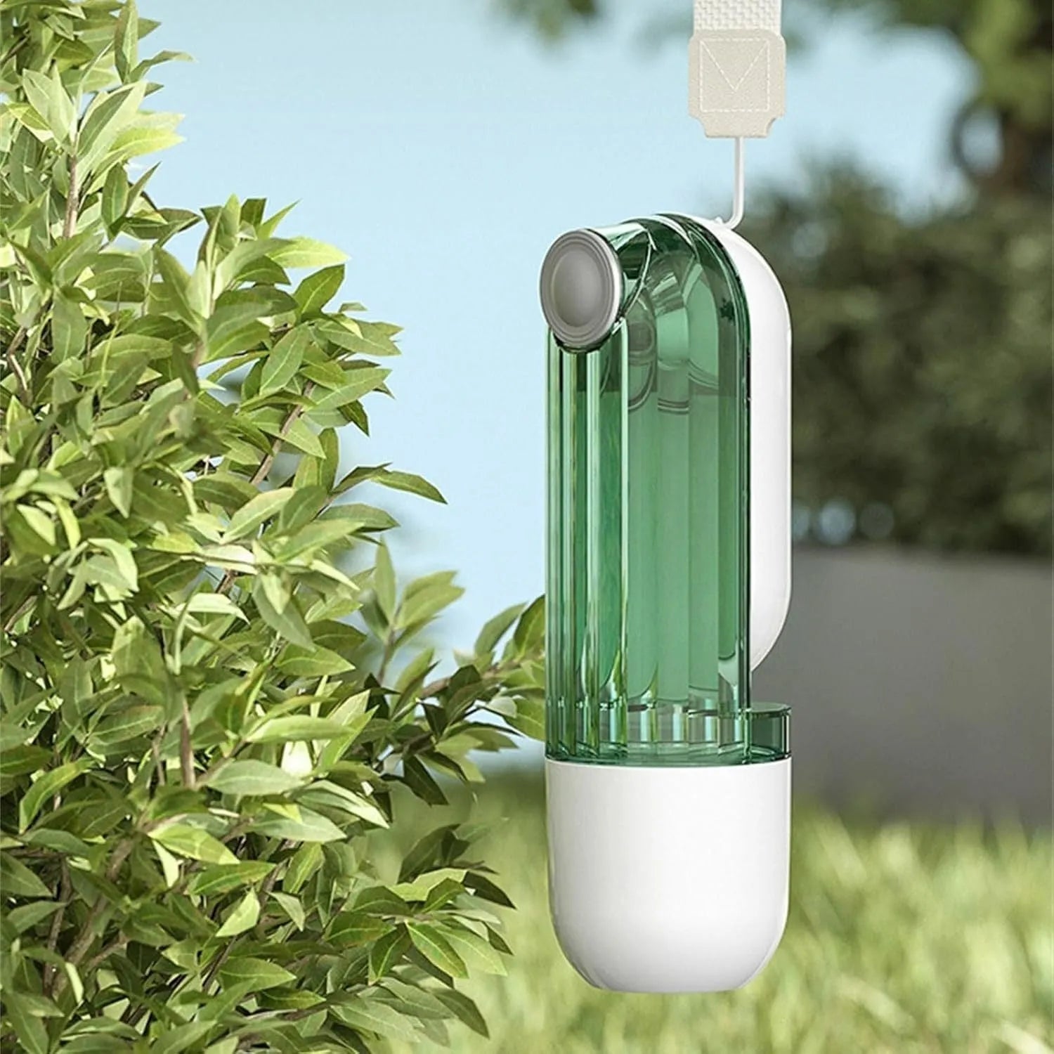 Beige and green foldable dog water bottle with integrated food container at the base