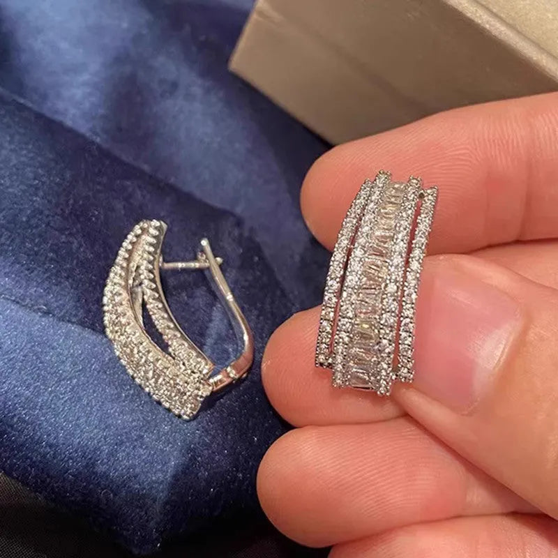 Geometric shaped white gold colour stud earrings with inlaid zircon stone for women.