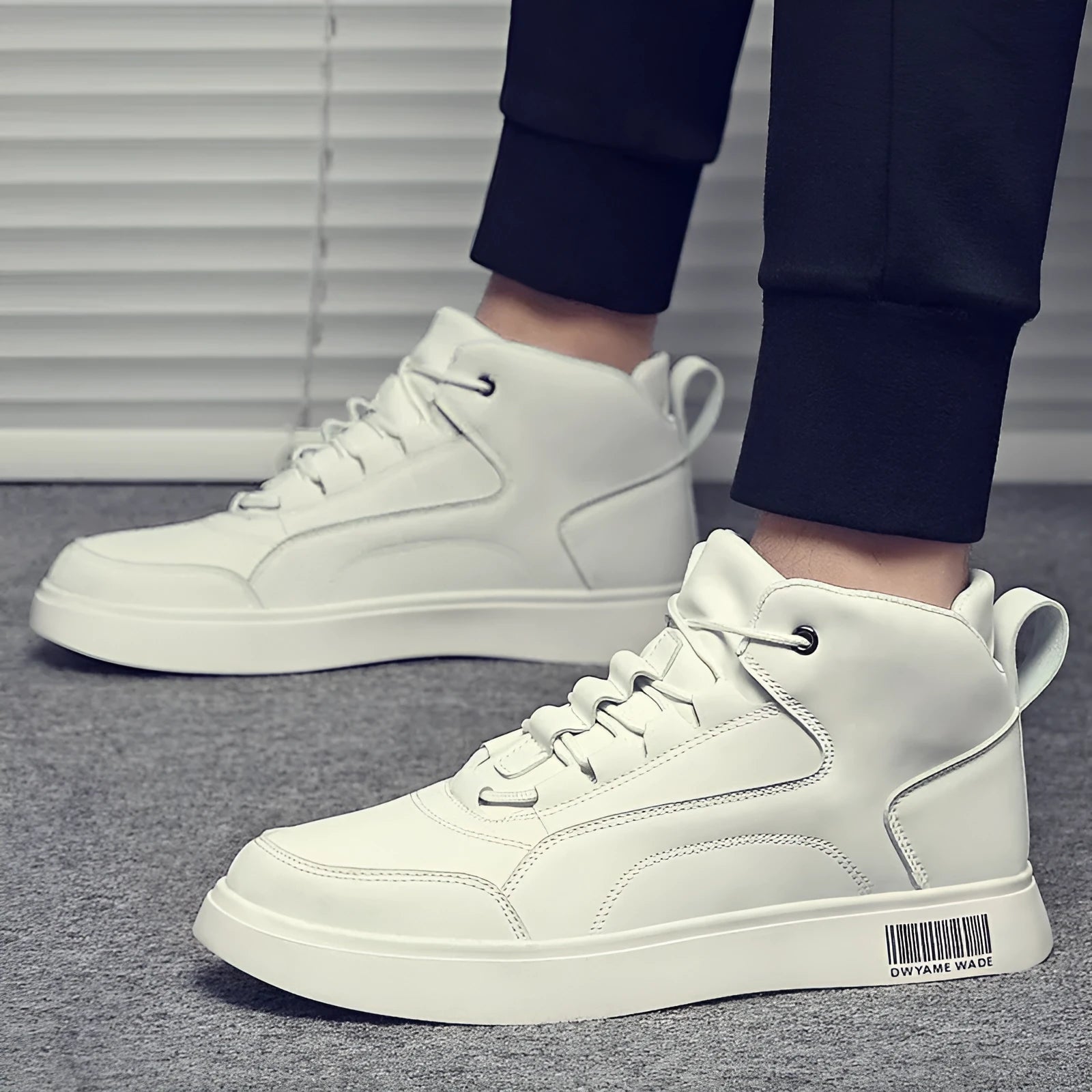 Men's white mid-top casual sports shoes with lace-up front and flat rubber sole.