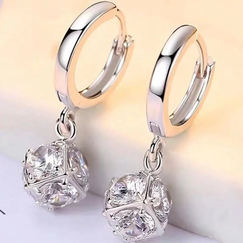 Geometric copper zircon earrings with rose design elements in multiple colour variations