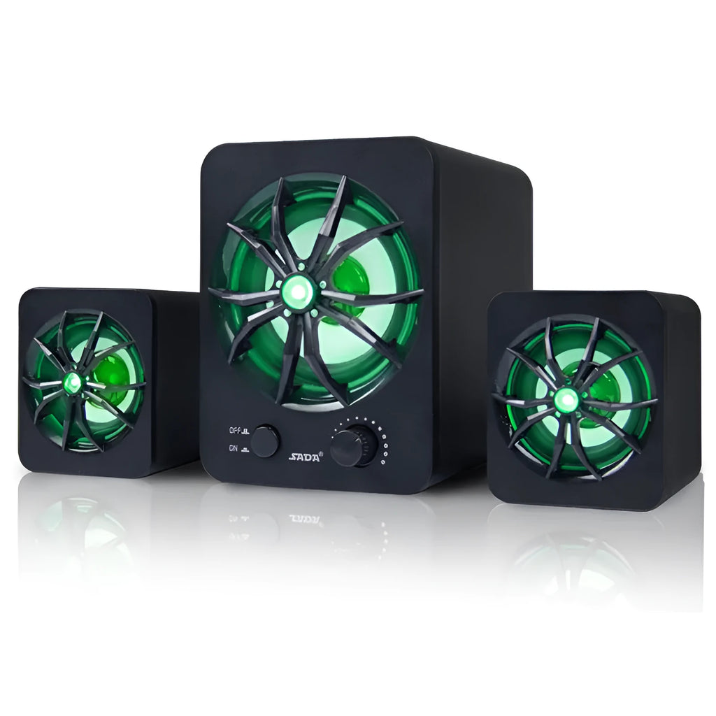 Green 2.1 USB computer speaker with glowing coloured lights on a desk next to a laptop.