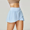 Women's solid colour quick-dry sports shorts in nylon with spandex lining for running and fitness.