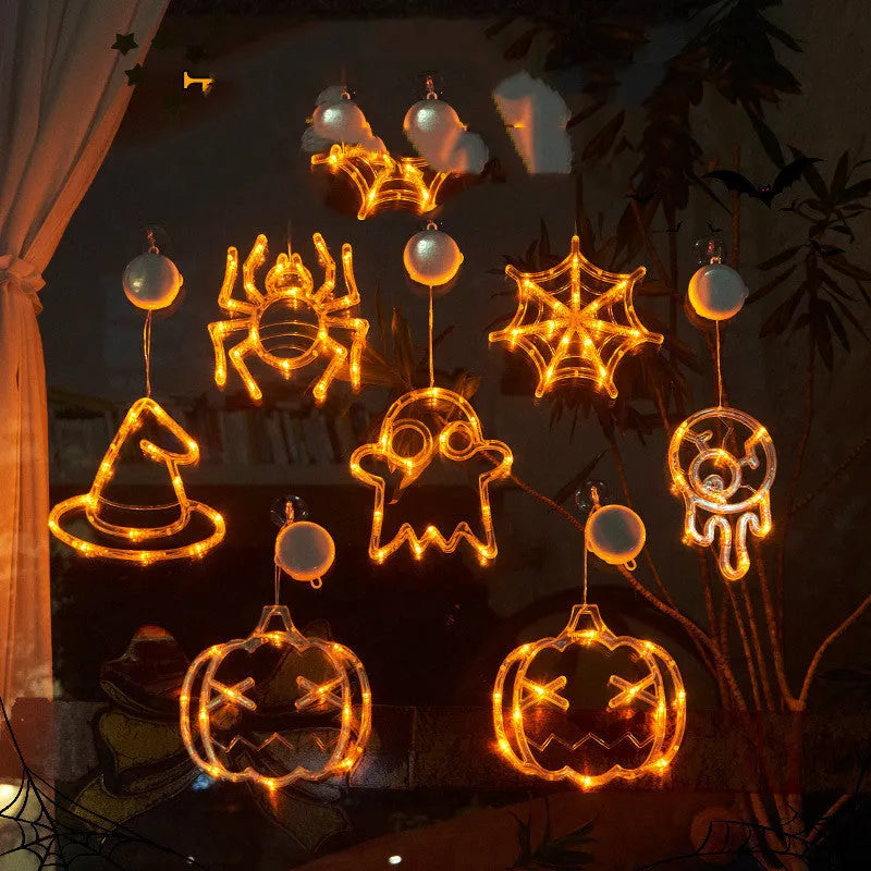 Halloween window hanging LED lights set with spider and pumpkin designs using suction cup installation