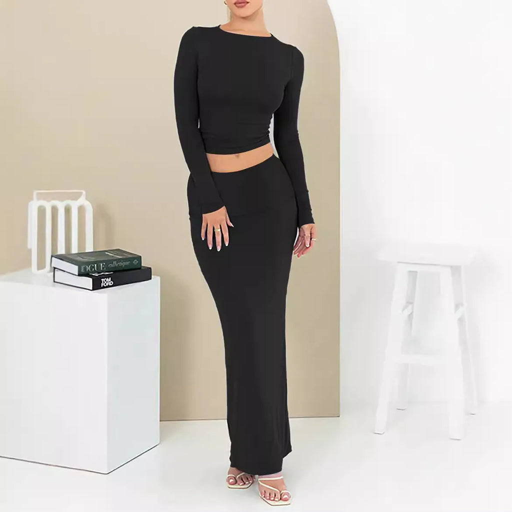 Women's autumn two-piece suit set showing top with three-quarter sleeves and matching long skirt