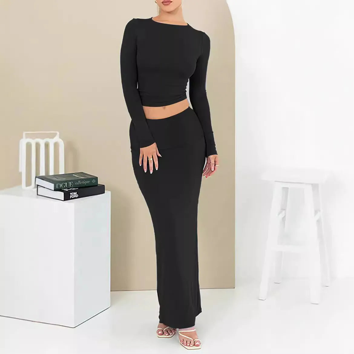 Women's autumn two-piece suit set showing top with three-quarter sleeves and matching long skirt