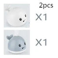 Electric whale-shaped bath toy with water spray, LED lights, and automatic water sensing for babies