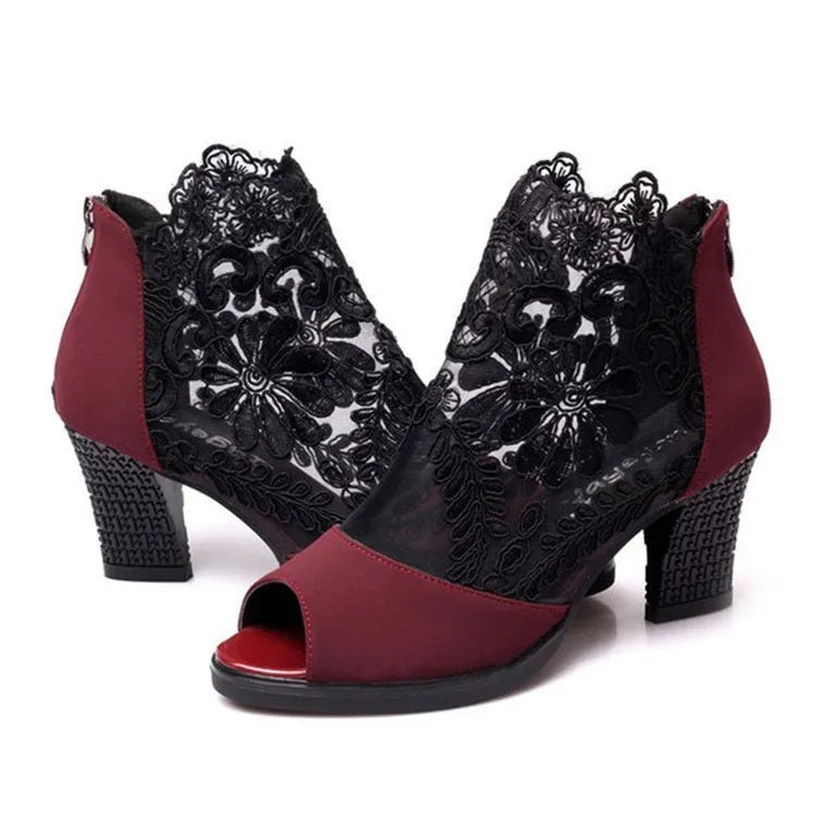 Black women's lace-up gladiator sandals with a square heel and zip fastener.