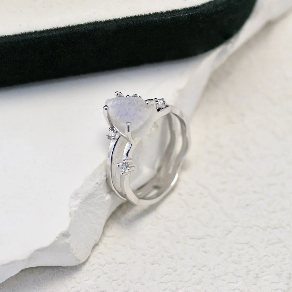 S925 silver geometric ring with irregular triangle design and moonstone, shown in rose gold finish.