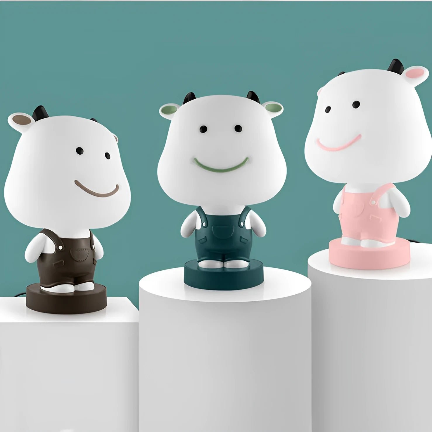 A plastic cartoon animal table lamp in a bear, cattle, rabbit, or tiger design with an LED light.