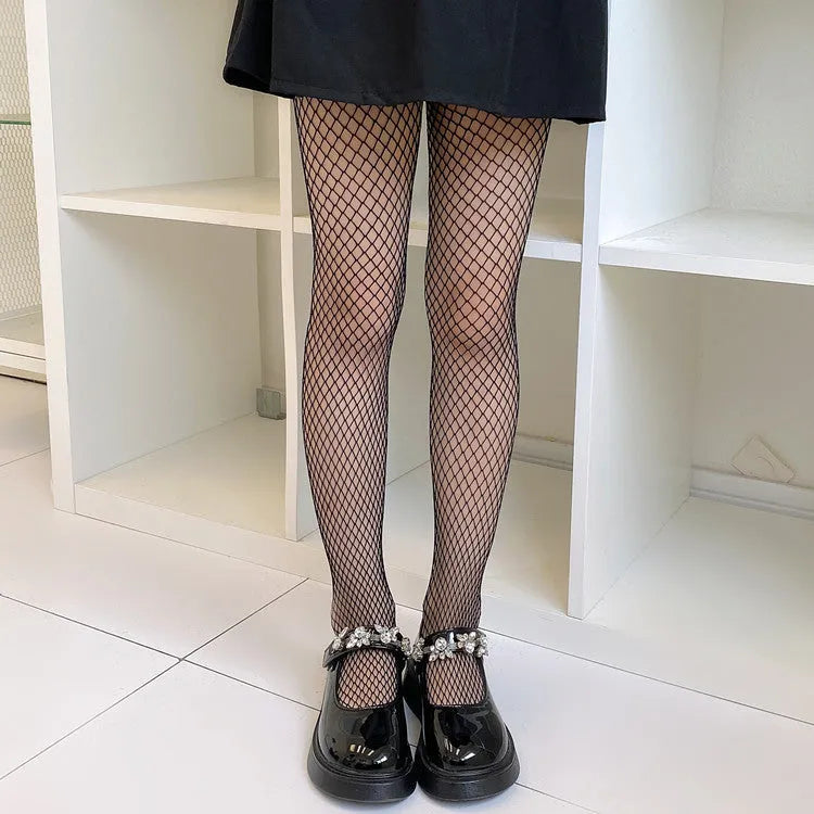 Women's sheer black and white mesh stockings showing large, medium, and small net patterns