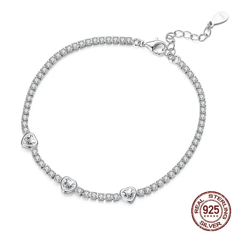 S925 sterling silver bracelet with heart-shaped clear zircon centrepiece on light background