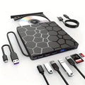 Black multifunctional external CD driver CD writer with USB cable on desk