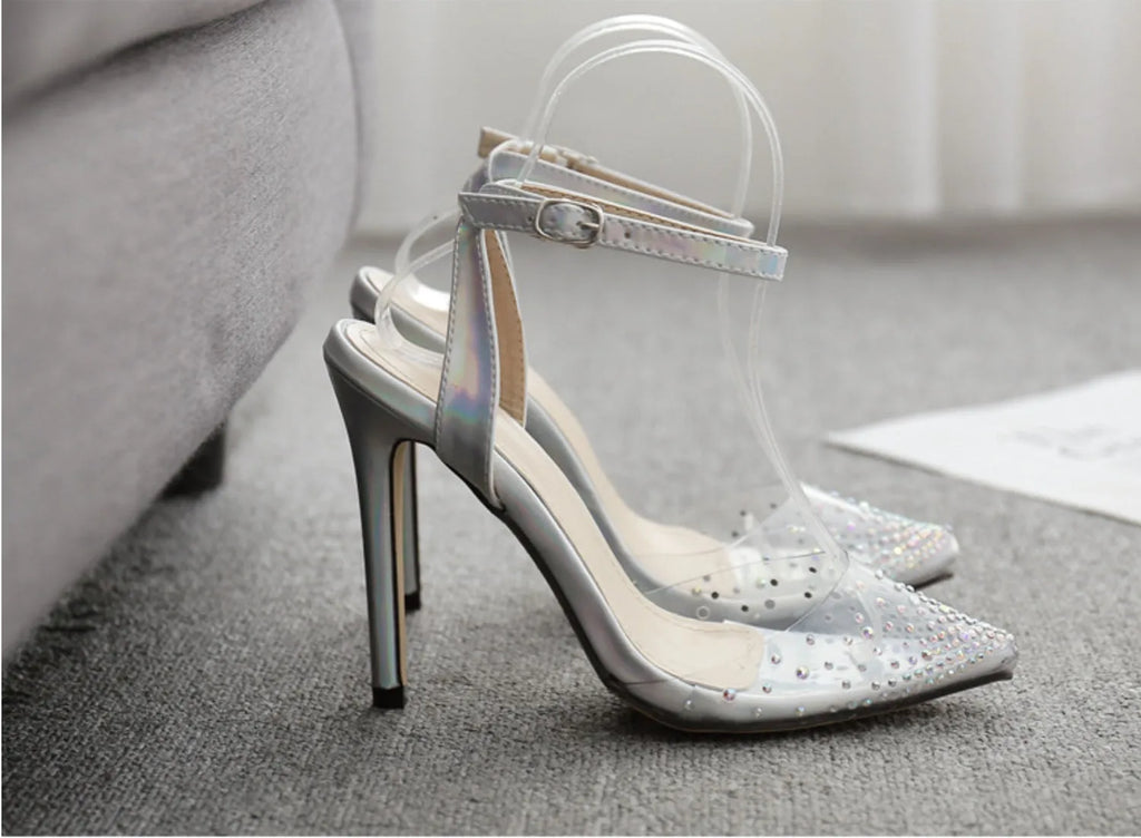 Silver glitter pointed-toe women's sandals with stiletto heels and diamond detailing.