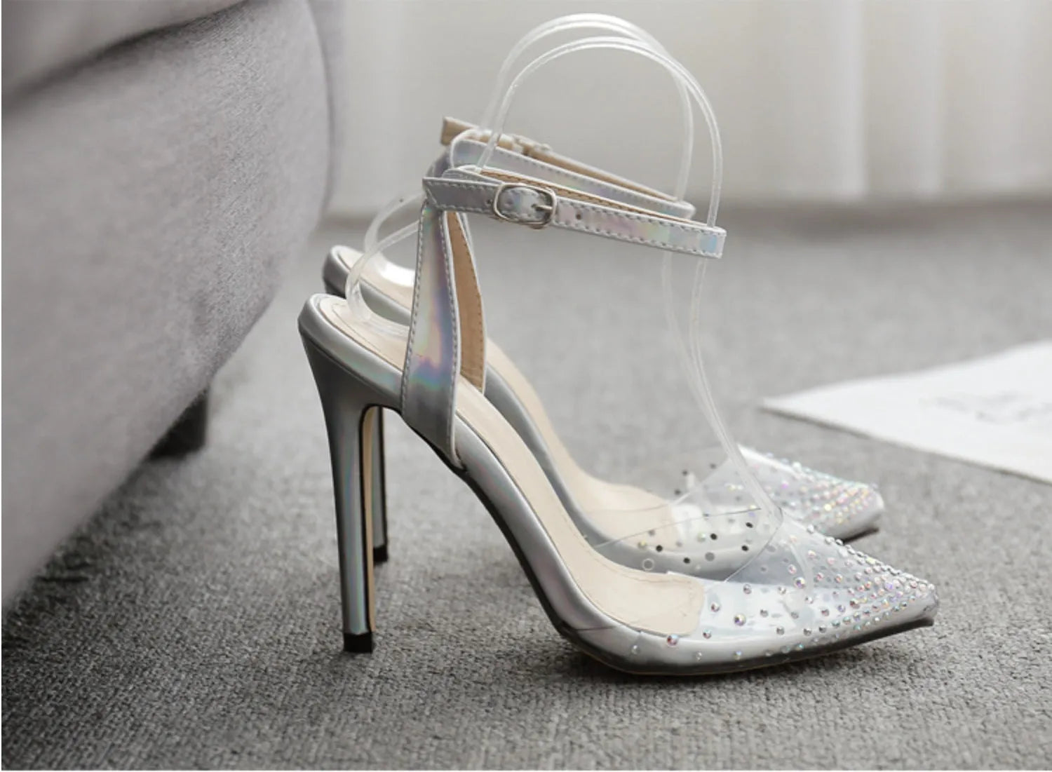 Silver glitter pointed-toe women's sandals with stiletto heels and diamond detailing.