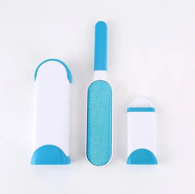 Blue self-cleaning pet hair removal brush for sofas on a grey fabric couch.