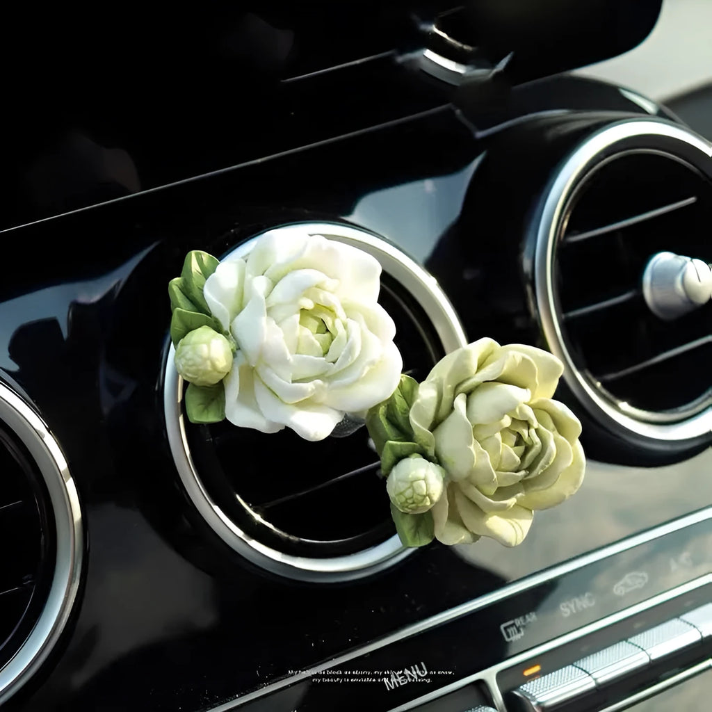 Solid gypsum car air vent perfume diffuser in off-white or green with 5ml jasmine oil bottle.